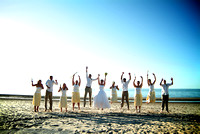 Beach wedding party jump