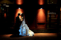 Bride and groom kiss outside in the rain at gordon biersch columbus ohio